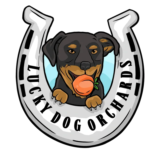 Lucky Dog Orchards logo: a dog with fruit in its mouth inside a horseshoe lettered with the name.